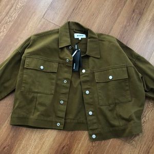 Oversized army green colored cropped denim jacket.